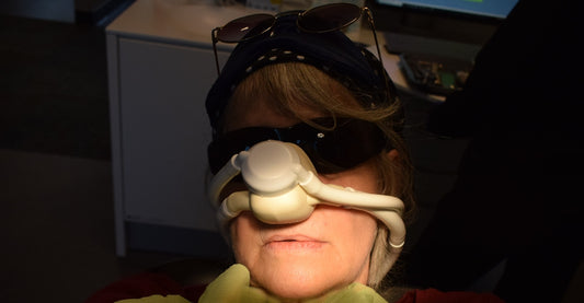 Woman wearing a nasal mask and goggles