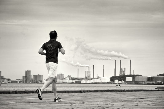 Man running with industrial background